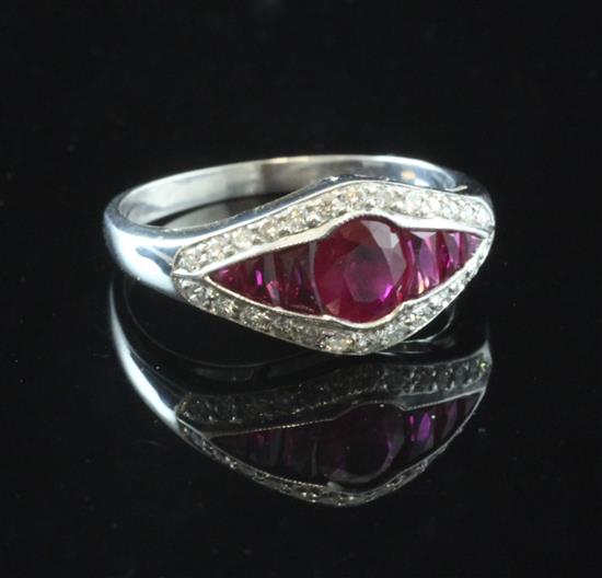 A white gold, ruby and diamond elliptical shaped ring, size M.